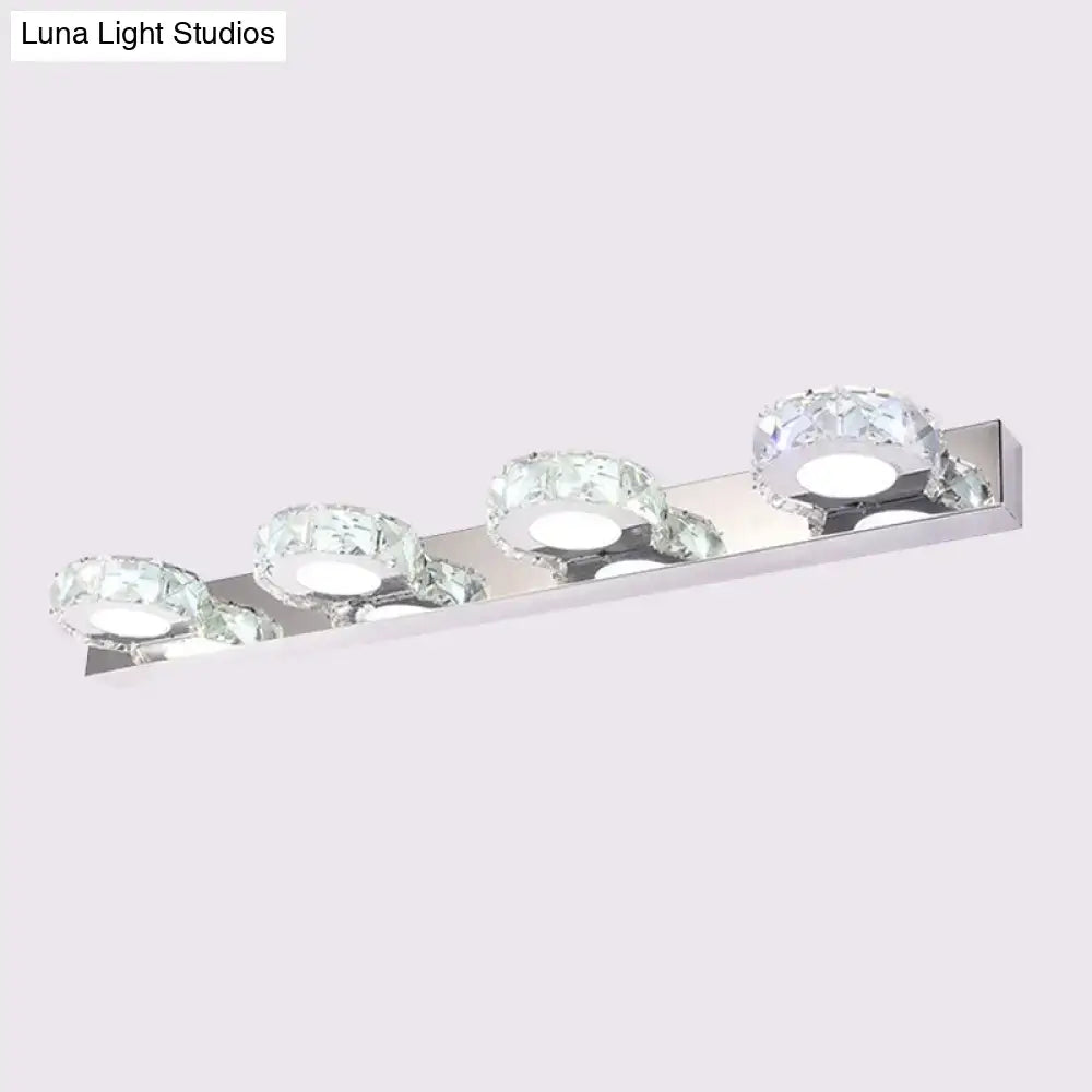 Modern chrome and gold crystal vanity sconce with four crystal-encrusted led bulbs for bathroom lighting
