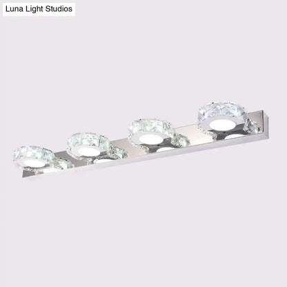 Modern chrome and gold crystal vanity sconce with four crystal-encrusted led bulbs for bathroom lighting