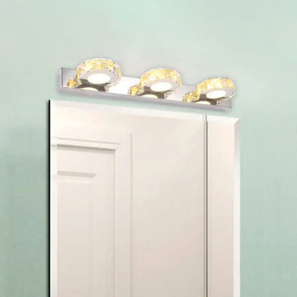 Modern chrome and gold crystal vanity sconce with three faceted yellow crystal led bulbs for bathroom lighting
