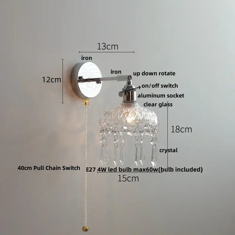 Modern chrome wall light fixture with polished iron base, aluminum socket, clear glass shade, and crystal droplets
