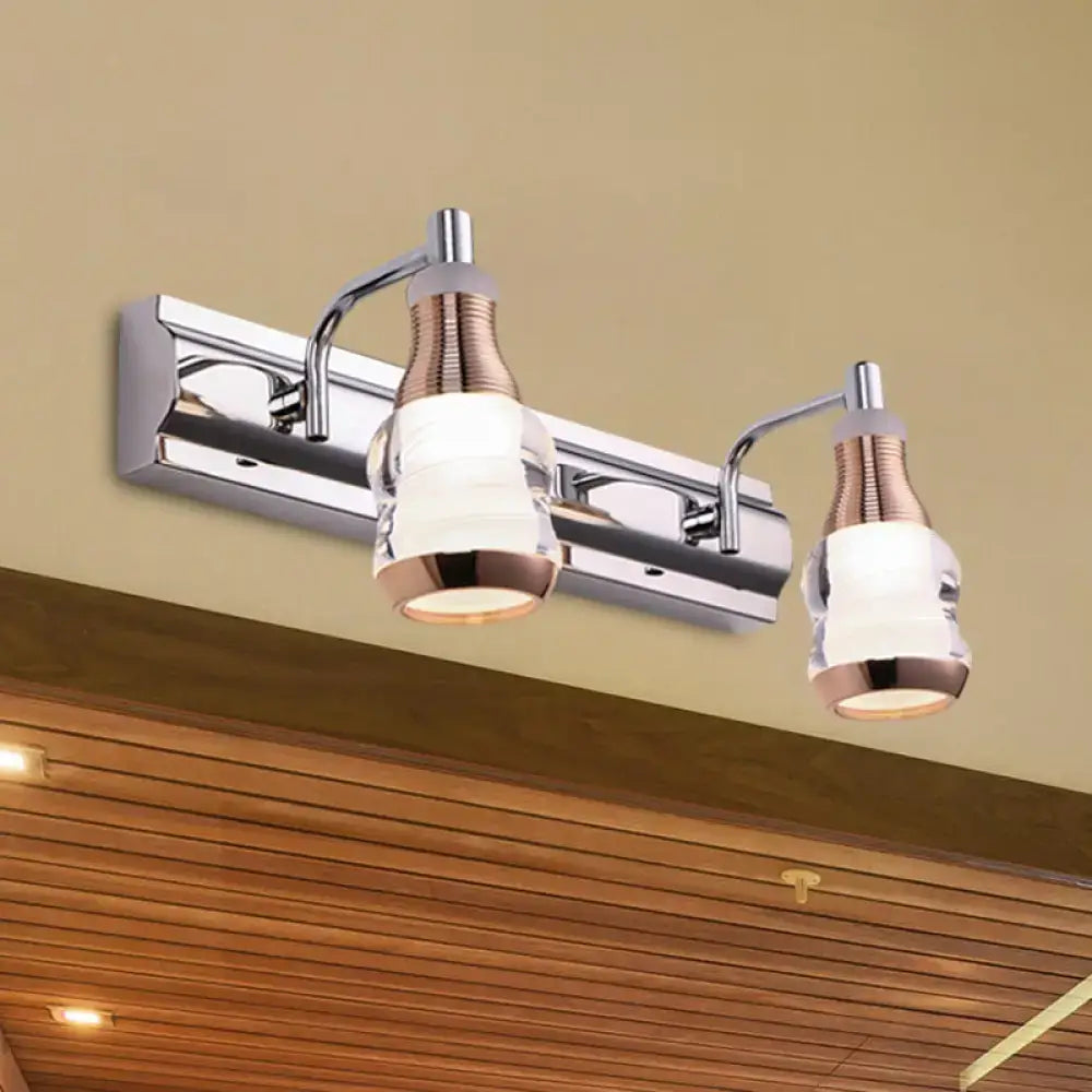Modern chrome and rose gold vanity wall light with two adjustable arms and frosted glass shades product includes wall light