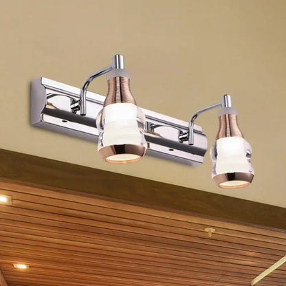 Modern chrome and rose gold vanity wall light with two adjustable arms and frosted glass shades product includes wall light