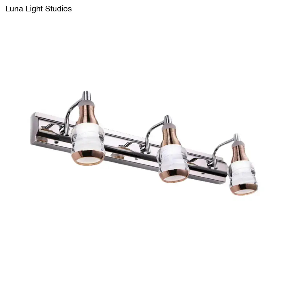 Modern chrome and rose gold vanity wall light with three frosted glass shades product includes sleek fixtures