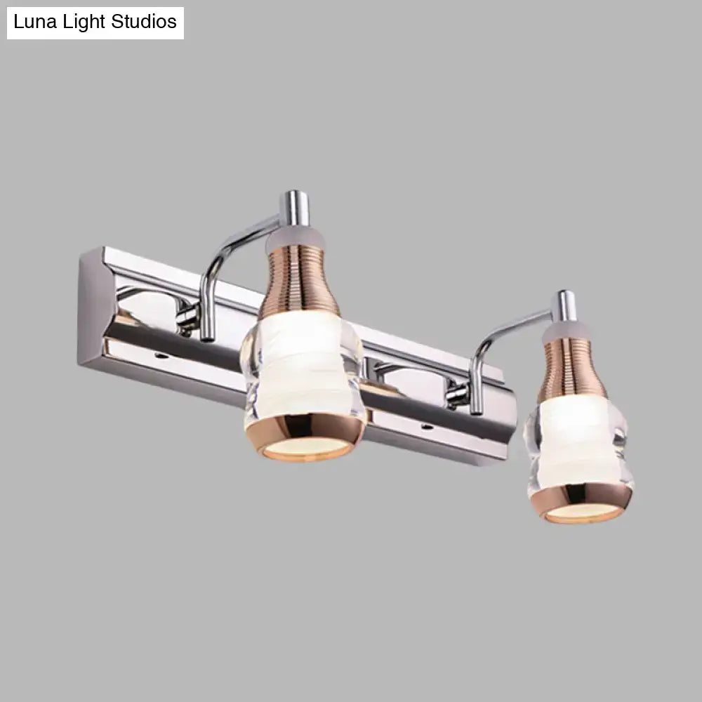 Modern chrome and rose gold vanity wall light with two frosted glass shades for bathroom vanity wall illumination