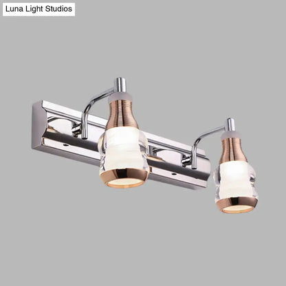 Modern chrome and rose gold vanity wall light with two frosted glass shades for bathroom vanity wall illumination