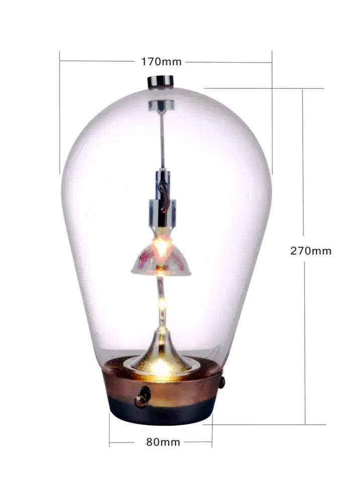 Modern chrome and transparent blow glass table lamp with a clear glass pendant and brass black base for living room decorbites lodes blow