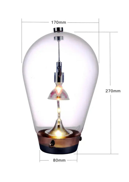 Modern chrome and transparent blow glass table lamp with a clear glass pendant and brass black base for living room decorbites lodes blow