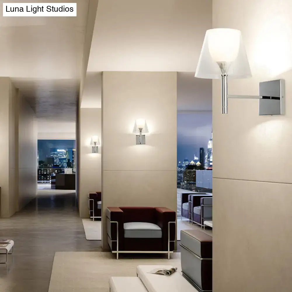 Modern chrome wall-mounted flared wall sconce with white glass shade for elegant living room lighting