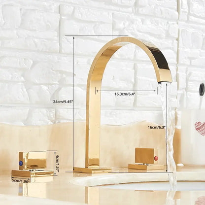 Gold-colored modern chrome arched dual handle basin faucet with blue and red accent stones for bathroom use