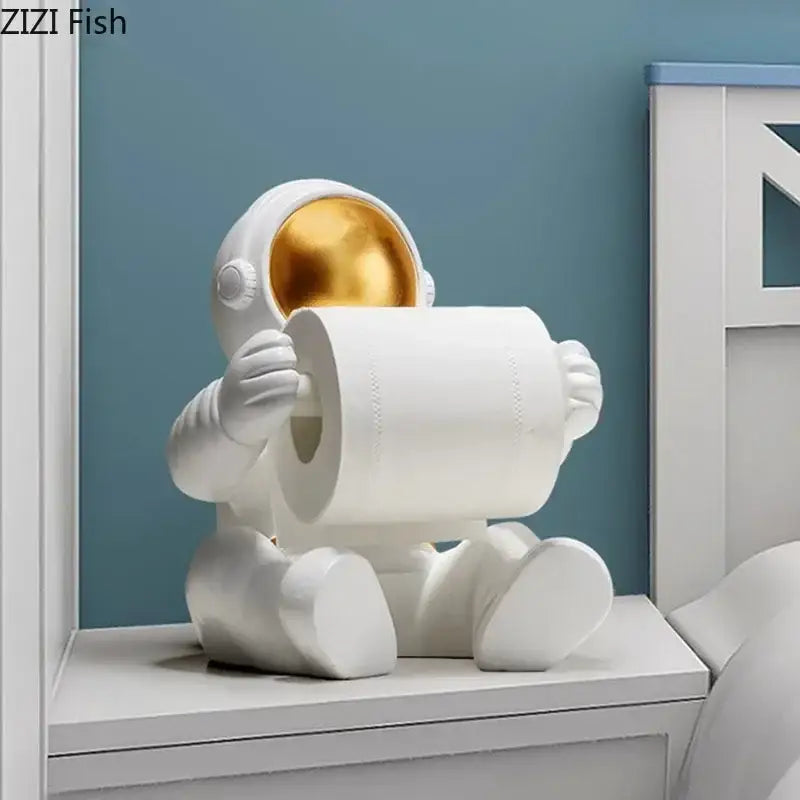 Modern chrome white astronaut tissue box holder with gold visor and glossy finish designed as whimsical decor piece