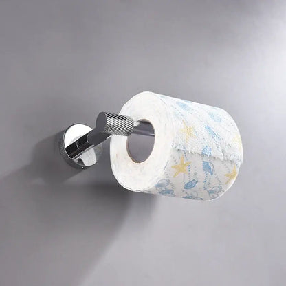Modern chrome bathroom essentials set featuring a chrome toilet paper holder with textured grip holding starfish tissue from decorbites bathroom essentials