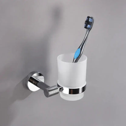Modern chrome bathroom essentials set featuring a chrome wall-mounted toothbrush holder with frosted glass cup and black blue toothbrush decorbites bathroom essentials