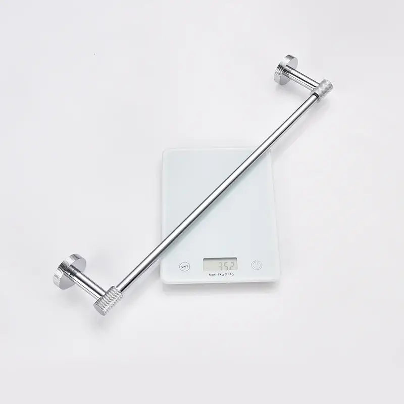 Silver-toned metal towel rack with textured knobs and modern design from decorbites bathroom essentials set