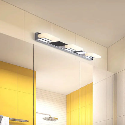 Modern chrome bathroom vanity light with four frosted acrylic shade panels and bulb included for bathroom use