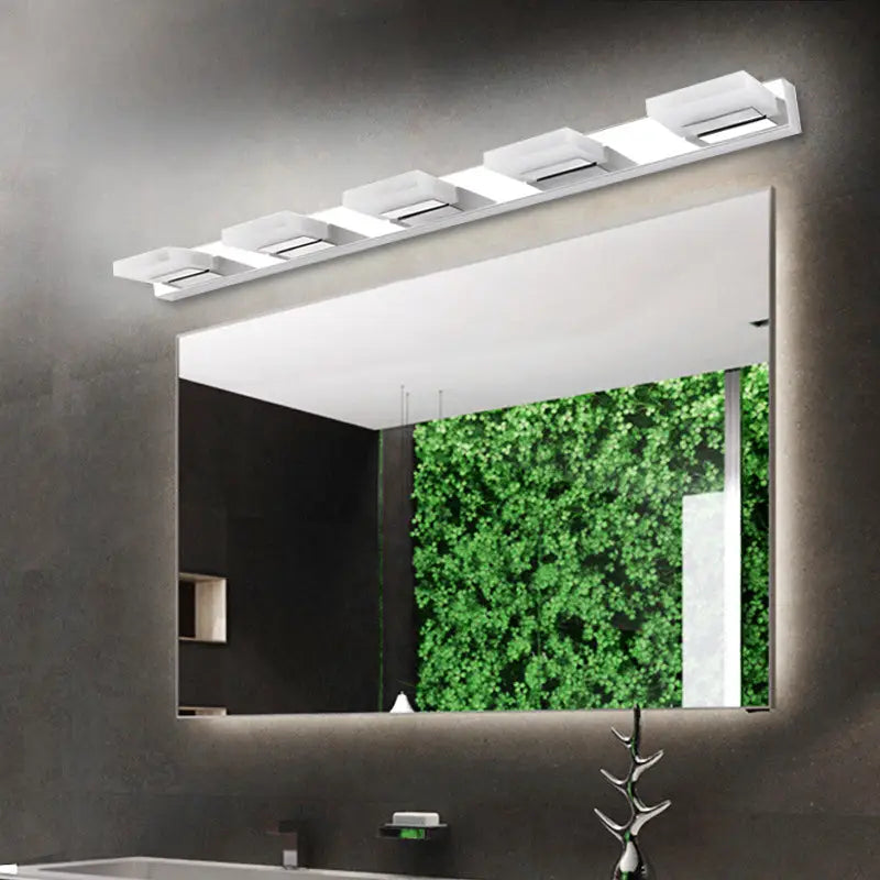 Modern chrome bathroom vanity light with five white acrylic shade fixtures mounted above mirror bulb included