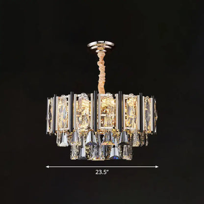 A modern clear beveled crystal chandelier with polished chrome finish featuring layered rectangular and teardrop crystals with adjustable chain cord length