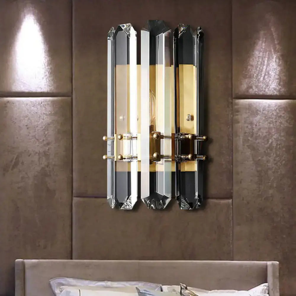 Modern chrome and black crystal wall sconce with three vertical panels and direct wired electric power source