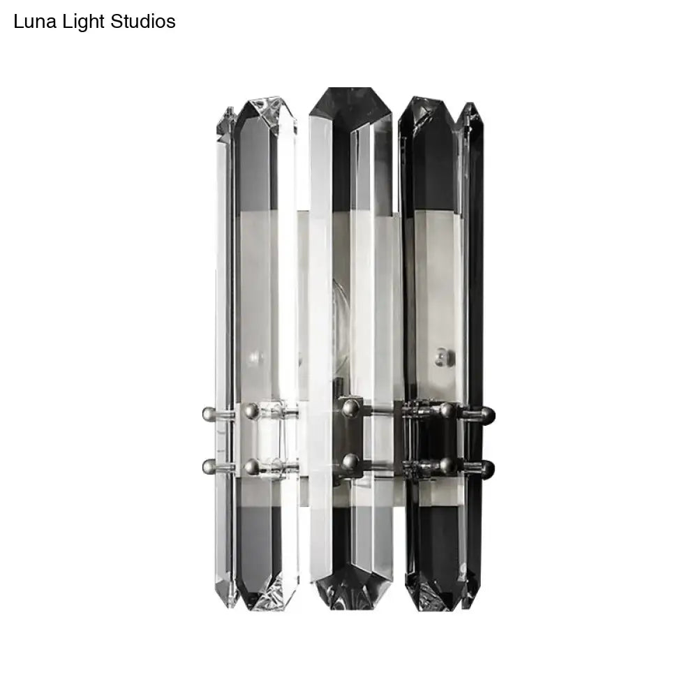 Modern chrome and black crystal wall sconce with three vertical bars featuring direct wired electric power source