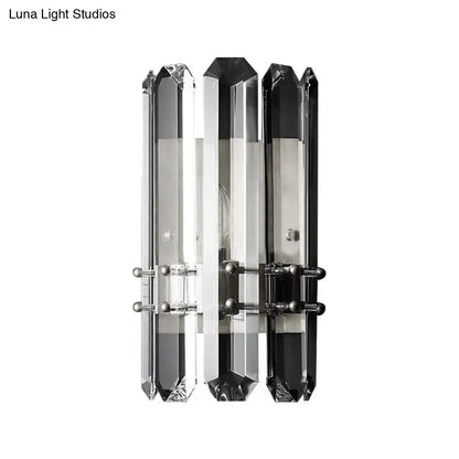 Modern chrome and black crystal wall sconce with three vertical bars featuring direct wired electric power source