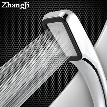 A sleek modern chrome and black rainfall shower head with a rectangular face handheld for bathroom use