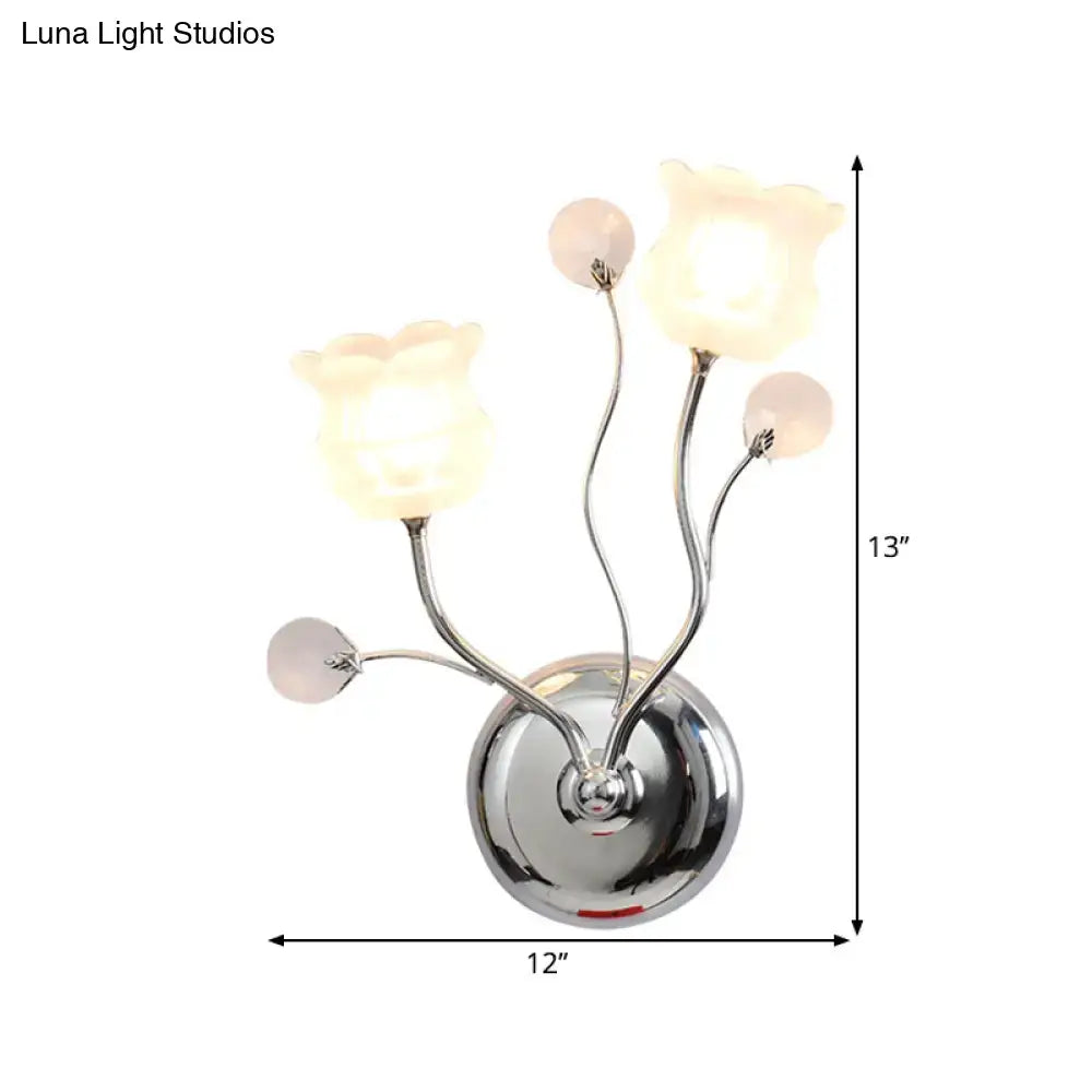 Modern chrome bloom shade wall sconce with clear crystal scrolling arm and frosted glass tulip shades for bedroom lighting