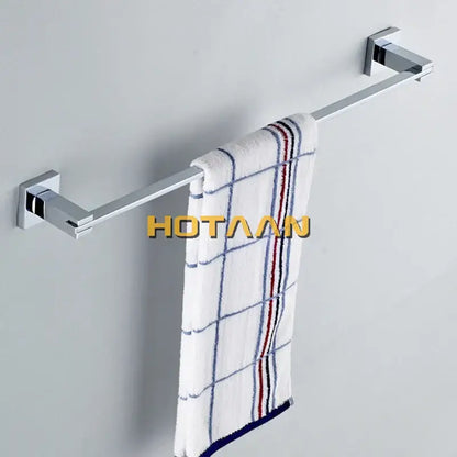 Modern chrome and blue stainless steel wall-mounted towel rack holding white towel with blue and red striped grid pattern bathroom accessories set
