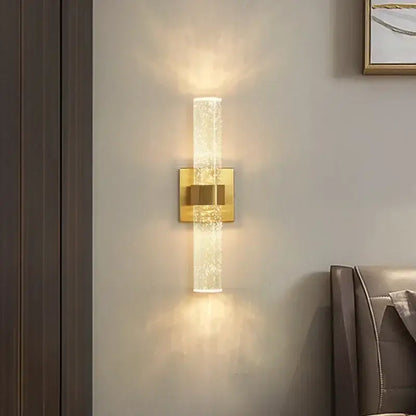 Modern chrome bubble crystal led wall lamp with gold-toned bubble crystal glass cylinder emits warm light for decorbites bubble crystal