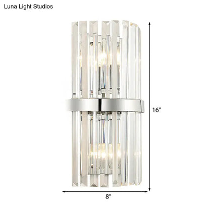 Modern chrome clear crystal cylinder wall sconce with vertical crystal rods and sleek chrome band for bedroom lighting