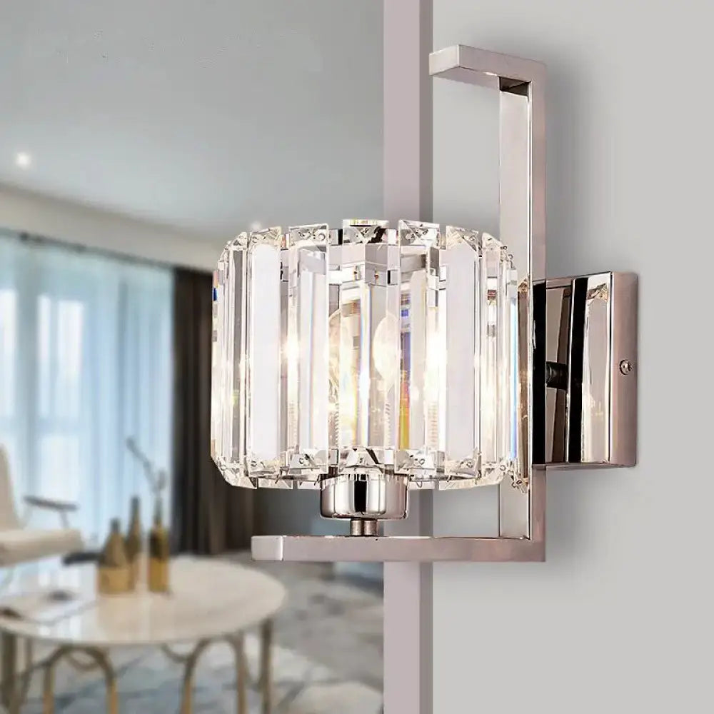 Modern chrome clear crystal drum wall lamp with vertical faceted glass panels and sleek metal frame for bedroom use