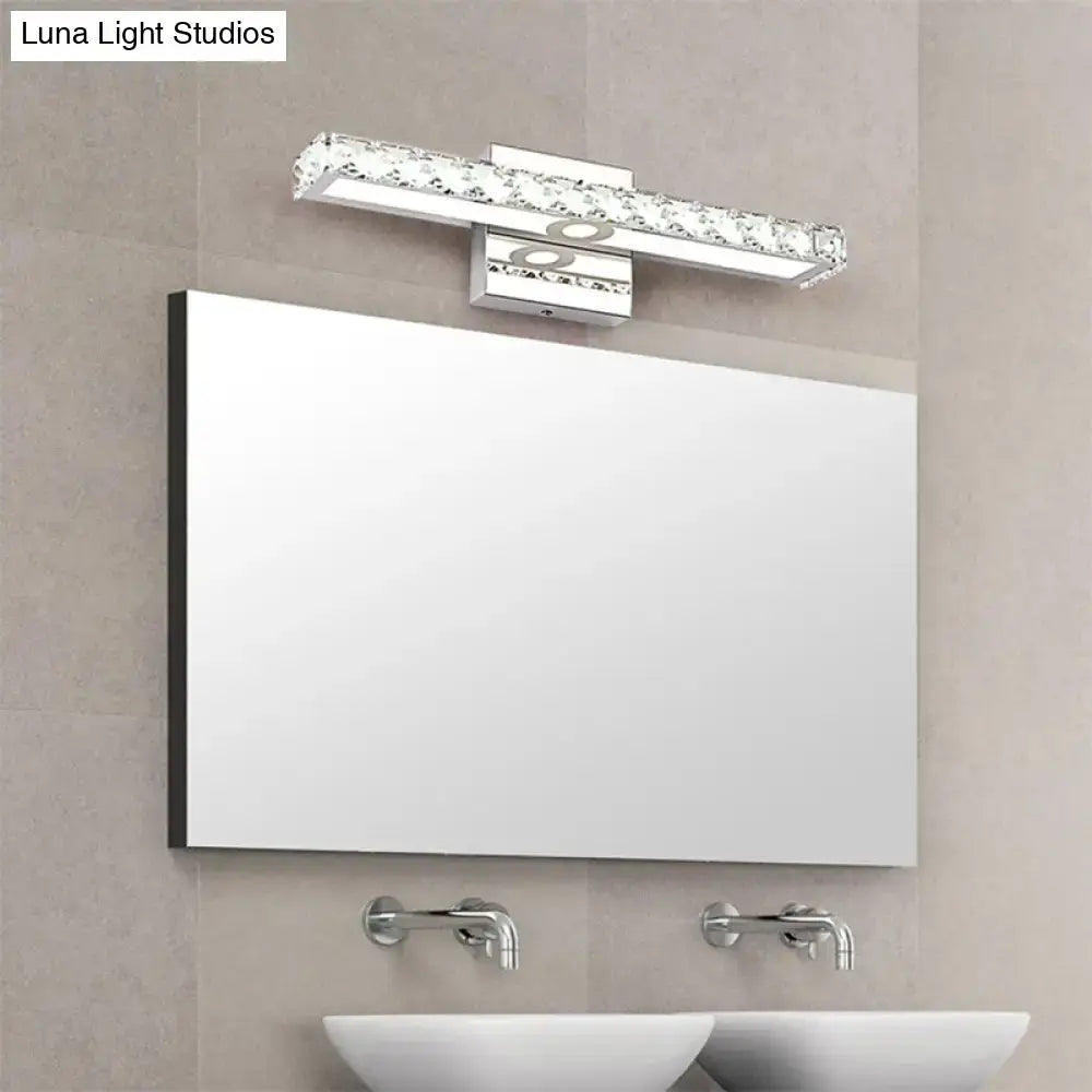 A sleek modern rectangular bathroom mirror with thin black frame paired with a 220v-240v clear crystal wall light