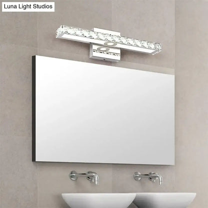 A sleek modern rectangular bathroom mirror with thin black frame paired with a 220v-240v clear crystal wall light