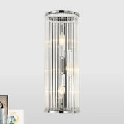 Modern chrome clear crystal shade wall light featuring cylindrical design with vertical glass rods and filament bulbs