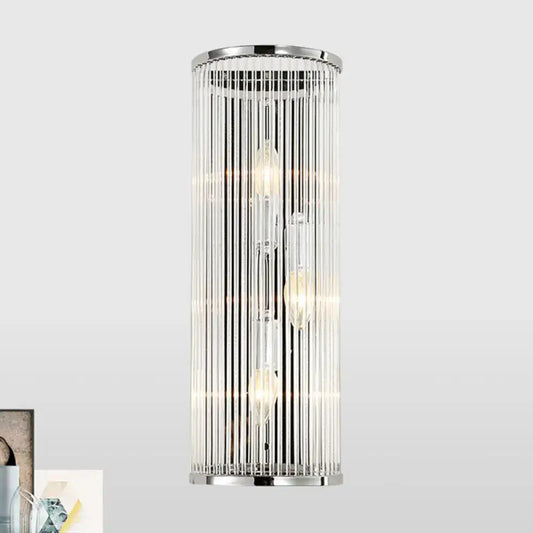Modern chrome clear crystal shade wall light featuring cylindrical design with vertical glass rods and filament bulbs