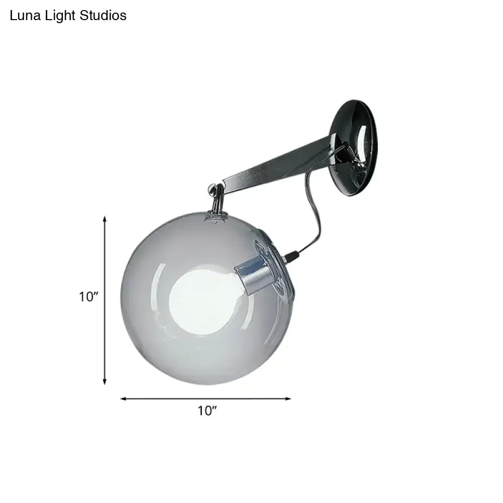 Modern chrome clear glass bubble wall sconce with a 10-inch glass bubble and polished chrome arm for bedroom lighting