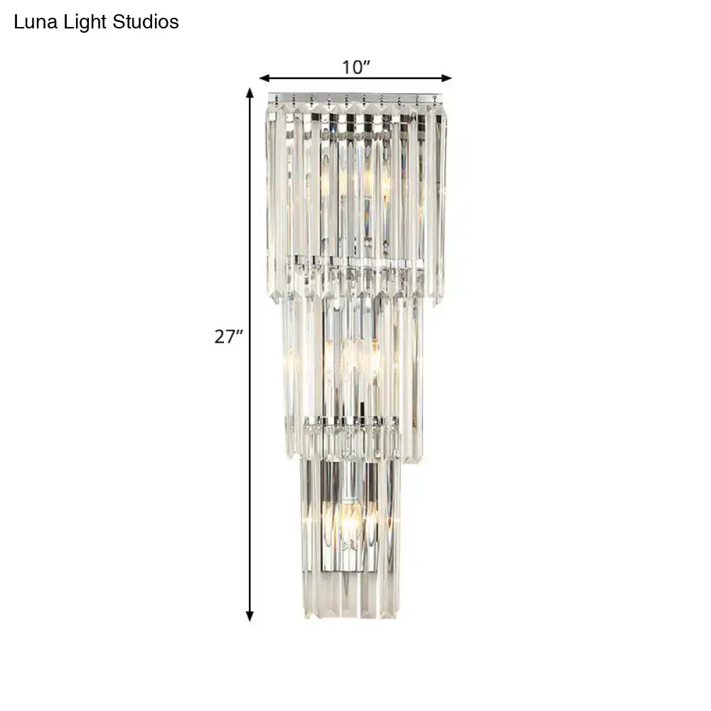 Modern chrome clear glass wall sconce light featuring a tiered crystal design with cascading clear glass shade rods