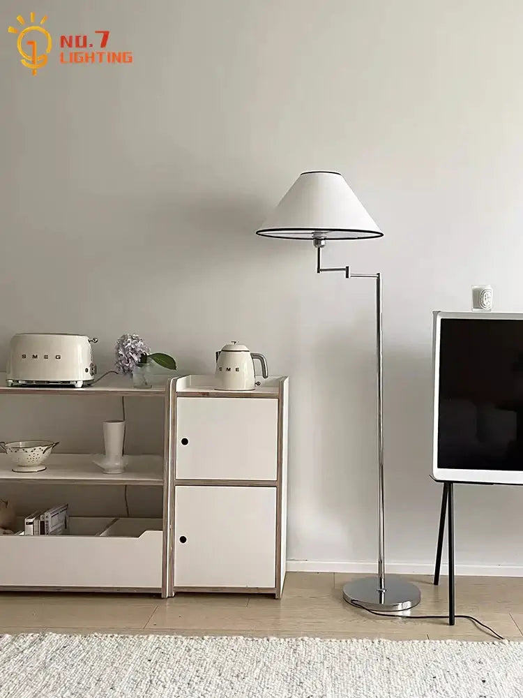 Modern chrome cream rocker arm floor lamp with white conical shade and slender chrome articulated arm for living room