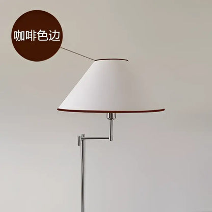 Modern chrome cream rocker arm floor lamp with a white conical lampshade and coffee-colored trim on chrome stand