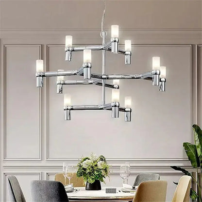 Modern chrome crown major chandelier with cylindrical frosted glass shades in a multi tiered kitchen light design decorbites crown major