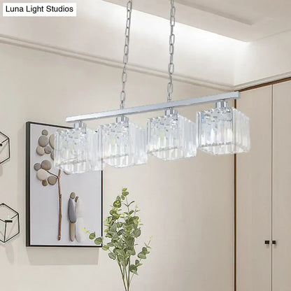 Modern DecorBites™ hanging lamp kit with four clear crystal block shades suspended by silver chains from chrome bar