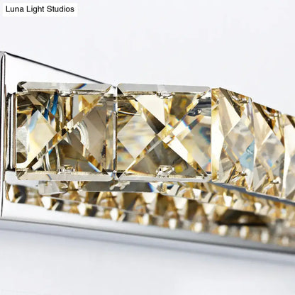 Modern chrome crystal encrusted wall light featuring faceted gold-toned crystals and polished chrome fixture height design
