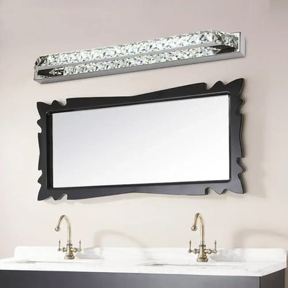 A sleek modern chrome crystal encrusted wall light fixture with embedded clear crystals and compact fixture height