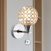 Modern chrome crystal encrusted wall light with spherical globe and faceted pendant for bedroom sconce lighting