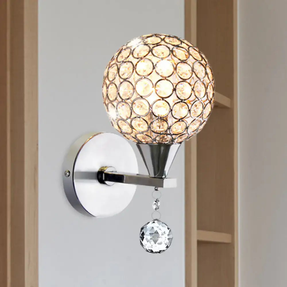 Modern chrome crystal encrusted wall light with spherical globe and faceted pendant for bedroom sconce lighting