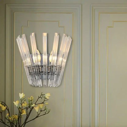 Clear crystal glass wall mount light with modern fan-like design and chrome metallic frame for corridor use