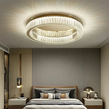 Modern chrome crystal led ceiling light with two concentric rings of faceted crystal and gold-toned metal frame