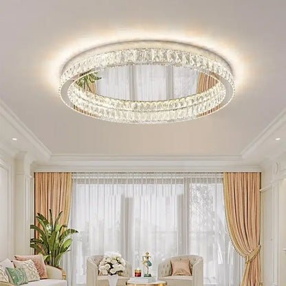 A modern chrome decorbites crystal led ceiling light with two concentric crystal rings in a sleek white frame