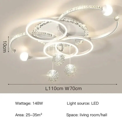 Modern white and crystal led pendant chandelier with interlocking rings and spherical ornaments for dining room lighting
