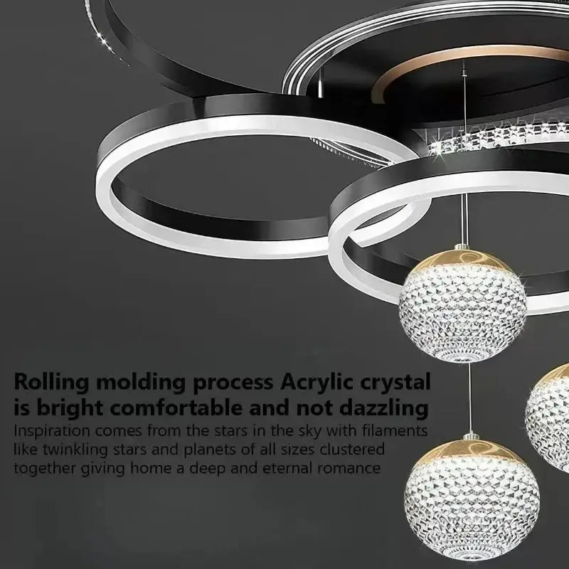 Modern chrome crystal led pendant chandelier with interlocking black and white rings and gold-toned globe pendants