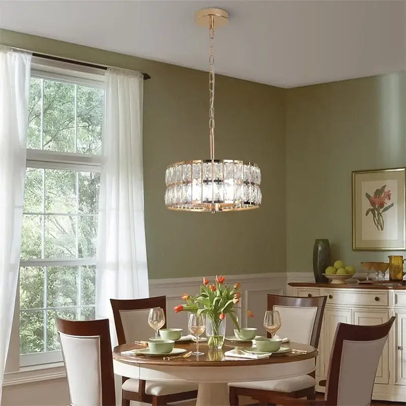 Modern chrome crystal led pendant chandelier with gold-finished metal frame and faceted prisms for dining room decorbites crystal led