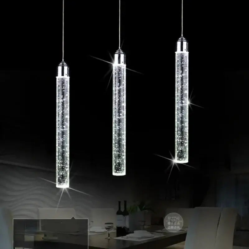 Three sleek cylindrical crystal led pendant lights with chrome finish for modern dining room decorbites crystal led design
